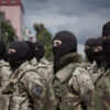Ukrainian Soldier Claims 'German Helmets and Flags' in Military: Unverified Reports Raise Questions