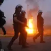 Clashes Erupt Between Riot Police and Migrants in Gravelines, Northern France, as Tensions Escalate